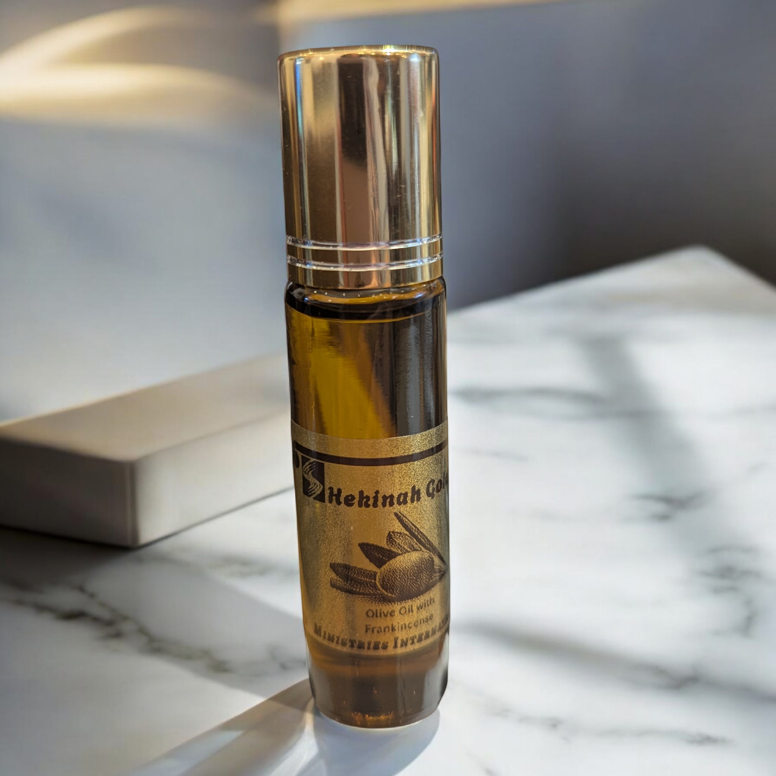 Shekinah Gold Anointing Oil 10ml roll-on glass bottles.