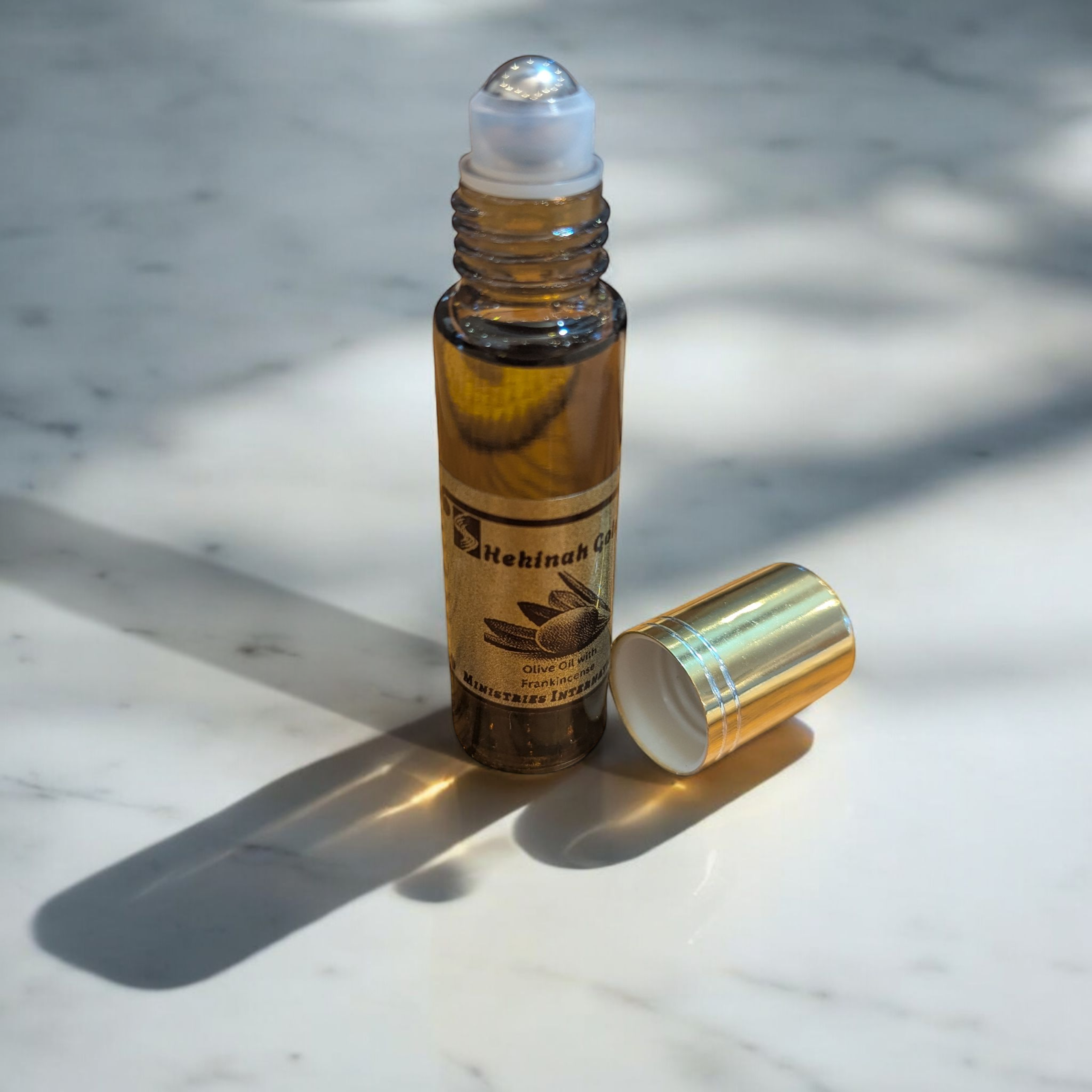 Shekinah Gold Anointing Oil 10ml roll-on glass bottles.